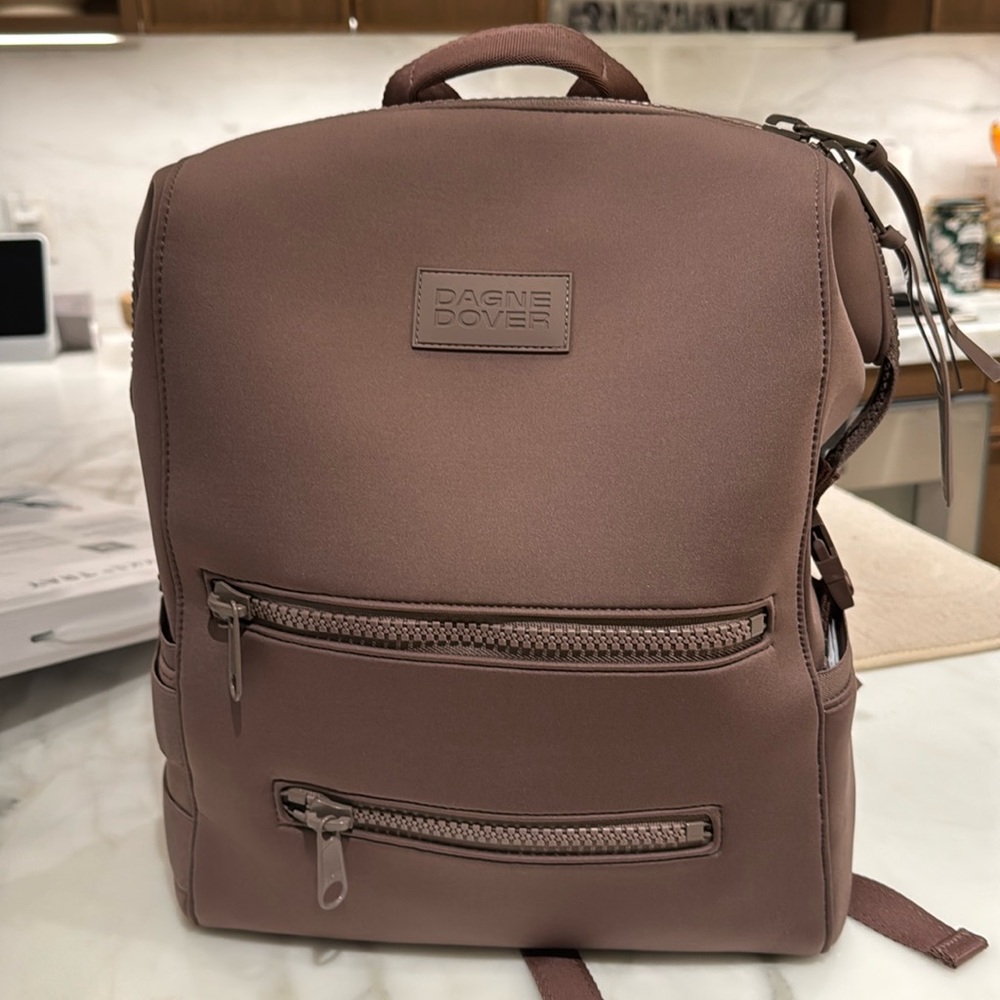 Brand new, never been used Dagne Dover backpack / diaper bag size large, purple